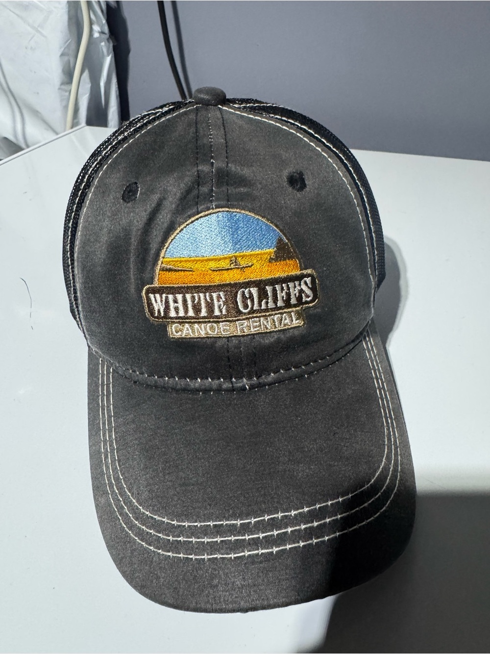 Source Unknown Black 'White Cliffs Canoe Rental' Embroidered Trucker Hat